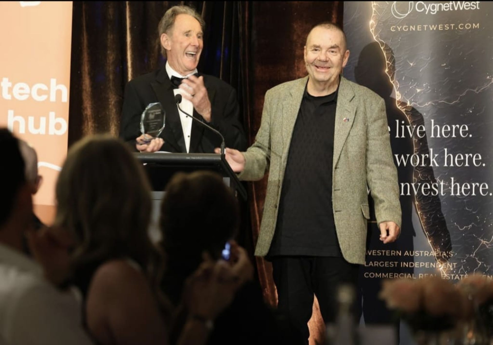 Jacek Korneluk PropTech Hub WA Awords Night receiving aword and title for Spektrumlab Pty Ltd 2026 Jacek Korneluk at a PropTech Hub WA awards event discussing compliant property tokenisation in Australia